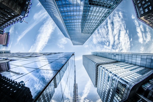 DLO Realty Group - Looking Up at Sky Scraper Buildings